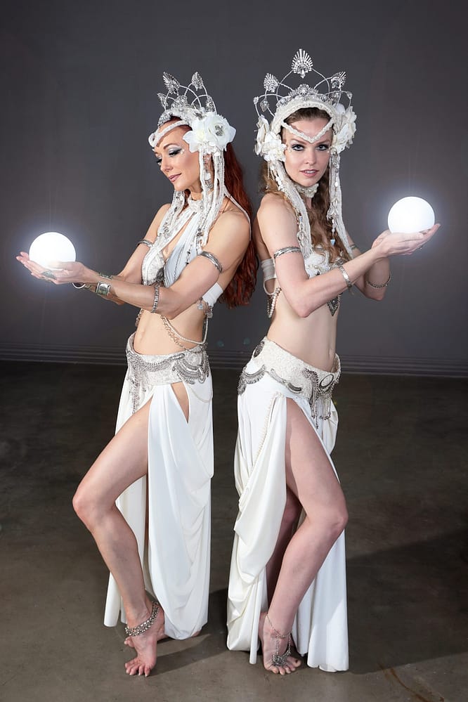 Two beautiful belly dancerss holding LED orbs - FemPyre Fire Art